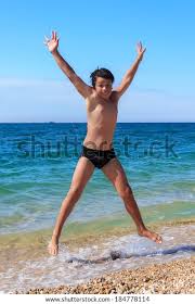 Happy Boy Jumping On Beach Stock Photo 184778114 | Shutterstock