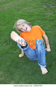 Happy Cheeky Child Kicking Playfully Stock Photo 22801441 ...